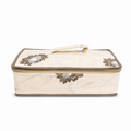 A quilted rectangular fabric storage bag with a zippered lid, featuring a cream-colored body, brown floral embroidery, and a matching top handle, shown against a plain white background.