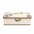 A quilted rectangular fabric storage bag with a zippered lid, featuring a cream-colored body, brown floral embroidery, and a matching top handle, shown against a plain white background.